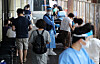 People wait to get tested for Covid-19 at a testing center in Songpa District, western Seoul, on Friday. [NEWS1]