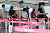 People line up to get tested for Covid-19 at a testing center in Yongsan District, central Seoul, on Friday. [YONHAP]