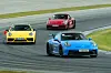 Porsche cars on a race track with the 911 GT3 in front [PORSCHE KOREA]