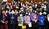 Voters listen to an election-related speech on a street in Seoul on Monday as they prepare to cast ballots to elect a new Seoul mayor on Wednesday. [NEWS1]