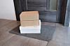 Parcels are left in front of a door. In Korea, packages are left generally outside to avoid unnecessary contact during the Covid-19 pandemic. [SHUTTERSTOCK]