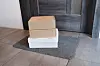 Parcels are left in front of a door. In Korea, packages are left generally outside to avoid unnecessary contact during the Covid-19 pandemic. [SHUTTERSTOCK]