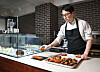 Pastry chef Choi Kyu-sung of Cedrat in Gangnam District, southern Seoul, puts out fresh baked madeleines in the morning before the store opens. [PARK SANG-MOON]