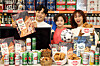 Models pose for promotional snacks that will be offered at Emart for a week from May 21 through May 27. [EMART]