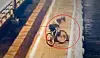 A screen capture of a cyclist stealing a bag of a man attempting suicide on Mapo Bridge. [SCREEN CAPUTRE]