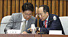 People Power Party's floor leader Kweon Seong-dong, left, and Finance Minister Choo Kyung-ho during a meeting on Monday at the National Assembly in Seoul. [JOINT PRESS CORPS]