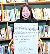 Yoo A-jin, 11, holds a handwritten thank-you letter that she received from Christopher Del Corso, the current head of the U.S. Embassy Seoul. [CHILGOK COUNTY OFFICE]