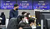 A screen in Hana Bank's trading room in central Seoul shows stock and foreign exchange markets open on Tuesday. [NEWS1]