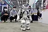 A team of engineers demonstrate their robot at the AI Korea 2021 exhibition in Haeundae, Busan, on Wednesday. The exhibition showcases artificial intelligence and blockchain technology from various companies, and runs through Friday. [YONHAP]
