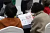 Senior citizens read pamphlets at a job fair held Yangcheon District, western Seoul, on Nov. 9. [NEWS1]