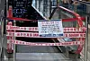 An escalator in Good Morning City is blocked with a notice saying 'temporarily closed due to business downturn affected by the pandemic.' [KIM JI-YE]