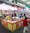 People walk past Orion's 'Kernel Fruit Shop' pop-up in Gwangjang Market, central Seoul, on Monday. [YONHAP]