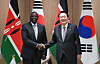 President Yoon Suk-yeol, right, shakes hands with Kenyan President William Ruto at the Yongsan Presidential Office in Seoul on Wednesday. [JOINT PRESS CORPS]