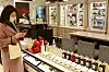 A customer looks at perfume products at a Lotte Department Store in Seoul. Lotte Department Store resumed its in-store beauty product testing service in early March when social distancing measures were eased. [LOTTE SHOPPING]