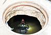 A firefighter searches inside a sewer in Seocho District for missing people Wednesday afternoon, after heavy rains flooded much of southern area of Seoul Monday evening. [WOO SANG-JO]