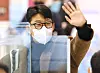 Son Heung-min waves to fans at the Incheon International Airport as he leaves for London on Tuesday. [YONHAP]