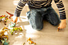 A child plays with dinosaur toys. The photo is used for illustrative purposes. [GETTY IMAGES]