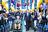President Yoon Suk Yeol, right, enters with 100-year-old independence fighter Oh Seong-gyu, pushed in a wheelchair by a military officer, for the 78th Liberation Day ceremony at a Ewha Womans University auditorium in Seodaemun District, central Seoul on Tuesday. [PRESIDENTIAL OFFICE]