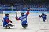 Korea's Lee Jong-kyung celebrates with teammate Choi Si-woo after scoring a goal against Italy during a para ice hockey qualifying final match at the 2022 Winter Paralympics in Beijing on Wednesday. [AP/YONHAP]