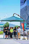 Large parasols strategically installed at pedestrian crossings during summer. [SEOCHO DISTRICT]