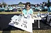 A young girl uses a brush to draw Korean letters during a calligraphy competition marking the 578th Hangul Day in Gwanghwamun Square in Jongno District, central Seoul, on Wednesday. [AP/YONHAP]