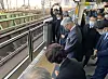 Korea's ambassador to Japan Yoon Duk-min, Lee Soo-hyun's mother and other mourners pay silent tribute Thursday at a subway platform at Shinokubo Station in Tokyo, where Lee Soo-hyun died at the age of 26 after trying to save a drunken Japanese man in January 2001. Thursday marks 22 years since the tragedy occurred. [YONHAP]