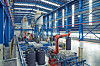 Automatic robots manufacture artificial graphite anodes, the key material for EV batteries, at Posco Chemical's Pohang facility in North Gyeongsang. [POSCO CHEMICAL]