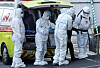 A medical team from Seoul Medical Center transfers a Covid-19 patient to a hospital in Jung District, central Seoul, on Sunday. The number of critically ill patients reached an all-time high of 894 on Sunday, according to the Korea Disease Control and Prevention Agency. [YONHAP]