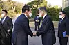 President Moon Jae-in, right, and President-elect Yoon Suk-yeol shake hands as they meet before their first dinner meeting at the Blue House in central Seoul Monday. [JOINT PRESS CORPS]