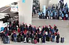 Migrant workers wait at bus stops at Incheon International Airport on Thursday shortly after arriving in Korea with E-9 nonprofessional employment visas. Local authorities said over 10,000 migrant workers are expected to arrive in the country this month as the Korean government eases restrictions to resolve labor shortages in small and medium-sized businesses. [YONHAP]