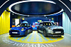 The new all-electric Mini Cooper, left, and Mini Countryman models on display at an exhibition titled 'Mini Heritage & Beyond' in southern Seoul on Monday. [BMW KOREA]