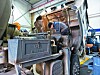 An employee works at a construction vehicle repair shop in Seo District, Incheon on Tuesday. Employees here often start working from 6 a.m. to 7 a.m. before the construction site begins. [BAEK IL-HYUN]