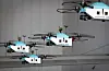 Korean Air Lines' airplane maintenance drones fly at the company's hangar at Gimpo International Airport in Gangseo District, western Seoul, on Thursday. The drones fly in teams of four, making the airline the first in the world to conduct maintenance using more than two drones at a time. According to Korean Air Lines, maintenance using drones cuts inspection time to four hours, compared to the 10 hours necessary when done by maintenance workers. [KOREAN AIR LINES]