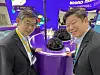 Dr. Kim Woo-kyu, managing director of Merck Korea, left, and Yun Yong-kuk, Merck Korea's country lead of display solutions, pose next to the German science and technology company's organic light-emitting diode (OLED) test cell at Korea Display Exhibition, or K-Display 2024, at Coex in southern Seoul on Wednesday. Merck participated in the show with five exhibition zones. [MERCK KOREA]