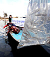 Young sweetfish are released into waters in the Nakdong River in Busan on Wednesday. A total of 70,000 young sweetfish, which is considered a luxury ingredient, will be released from Wednesday to Thursday to ramp up the population in the region. [YONHAP]
