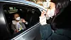 A first grader at Jeongpyeong Elementary School in Gyeongsan, North Gyeongsang, meets her teacher for the first time Monday during a drive-thru orientation organized by the school to prevent the spread of the coronavirus. [YONHAP]