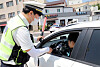 A police officer gives a random breathalyzer test to a driver in Jeju on Wednesday in an effort to curb daytime drunken driving as daytime drinking has been increasing under Level 4 social distancing measures. [NEWS1]