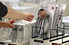 Customers shop for filtered shower heads at a local discount mart following recent reports of bugs discovered in water. [NEWS1]