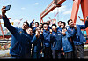 HD Hyundai Chairman Kwon Oh-gap, center, poses for a photo with foreign workers following a luncheon aimed at fostering inclusivity and addressing the needs of the workforce at HD Hyundai Heavy Industries' reception hall in Ulsan on Wednesday. [HD HYUNDAI]
