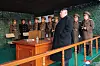 Kim Jong-un at an artiliery drill in March. The picture shows a flat smartphone placed on th desk. [KOREAN NEWS AGENCY]