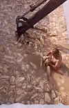 A video clip titled “Kimchi making in China” went viral online. A topless man is seen stirring cabbages floating in sludge-colored liquid that are then thrown into a rusty excavator. [SCREEN CAPTURE]