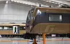 A mechanic inspects a Gimpo Goldline train at a railway depot in October 2023. [YONHAP]