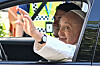 Pope Francis waves to a crowd from a Hyundai Motor Ioniq 5 EV as he heads to the National Stadium in Singapore to lead a Mass on Thursday. [AP/YONHAP]