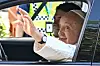 Pope Francis waves to a crowd from a Hyundai Motor Ioniq 5 EV as he heads to the National Stadium in Singapore to lead a Mass on Thursday. [AP/YONHAP]
