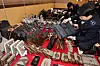 Customs officials examine counterfeit goods confiscated at the Incheon Regional Customs office in November 2023. [YONHAP]