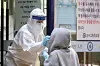 A student gets tested for coronavirus at a makeshift testing center at Seongsu High School in Seongdong District, eastern Seoul, Tuesday, after a high school senior tested positive. [NEWS1]