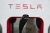 Tesla's EV charging connector is pictured at a charging station in Anaheim, California on June 9. Recently, Ford, General Motors, Volvo Cars and Rivian announced their adoption of Tesla's North American Charging Standard charging plug. [AP/YONHAP]