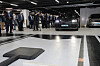 Science and ICT Minister Lee Jong-ho watches a demonstration of wireless charging for electric vehicles (EVs) at a parking lot at Hyundai Motorstudio in Goyang, Gyeonggi, Tuesday. The science minister visited the company to inspect trial runs on wireless EV charging systems. [NEWS1]