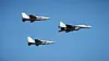 The first of two Korean FA-50 light fighter aircraft delivered to Poland fly above Warsaw in formation behind a MiG-29 fighter on Tuesday during a military parade in Warsaw to celebrate the country's Armed Forces Day. [KOREA AEROSPACE INDUSTRIES]