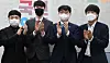 People Power Party Chairman Lee Jun-seok, right, meets the party's new spokesmen, from left, Lim Seung-ho and Yang Jun-woo, and deputy spokesman Shin In-gyu at the National Assembly on Tuesday, the day after their televised debate. [LIM HYUN-DONG]